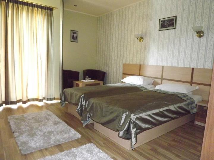 Postel nebo postele na pokoji v ubytování Hotel Stogu