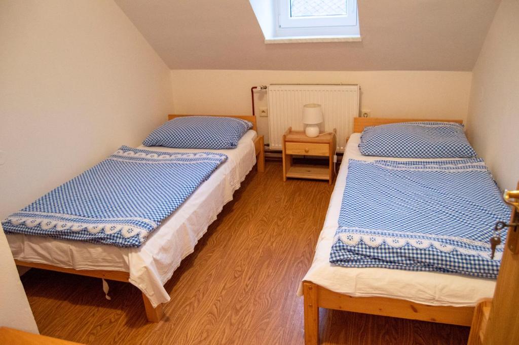 Postel nebo postele na pokoji v ubytování Penzion Holacký