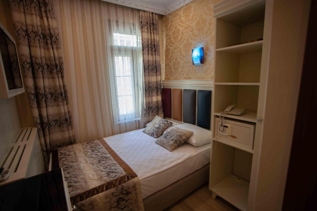 Postel nebo postele na pokoji v ubytování Best Nobel Hotel