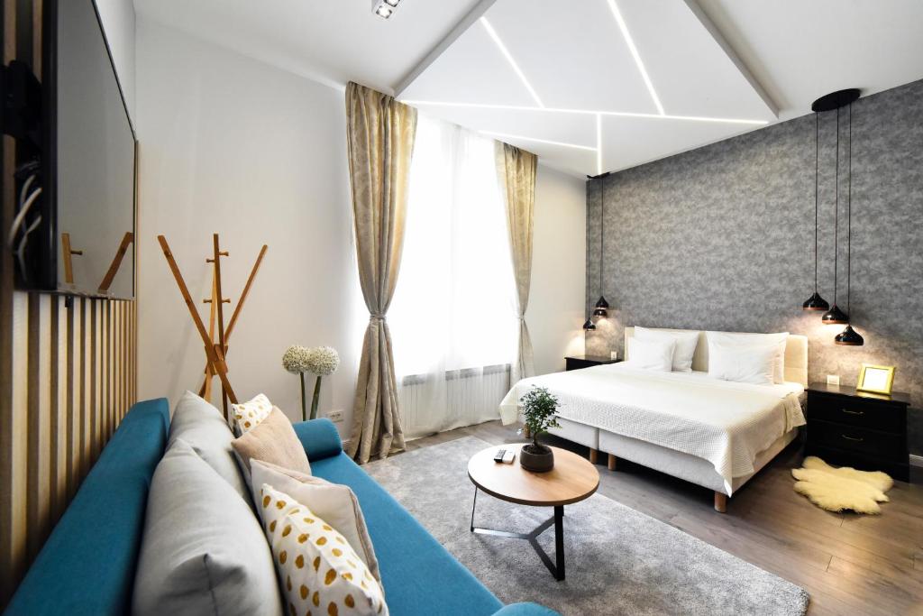 Posteľ alebo postele v izbe v ubytovaní Time Apartments Downtown