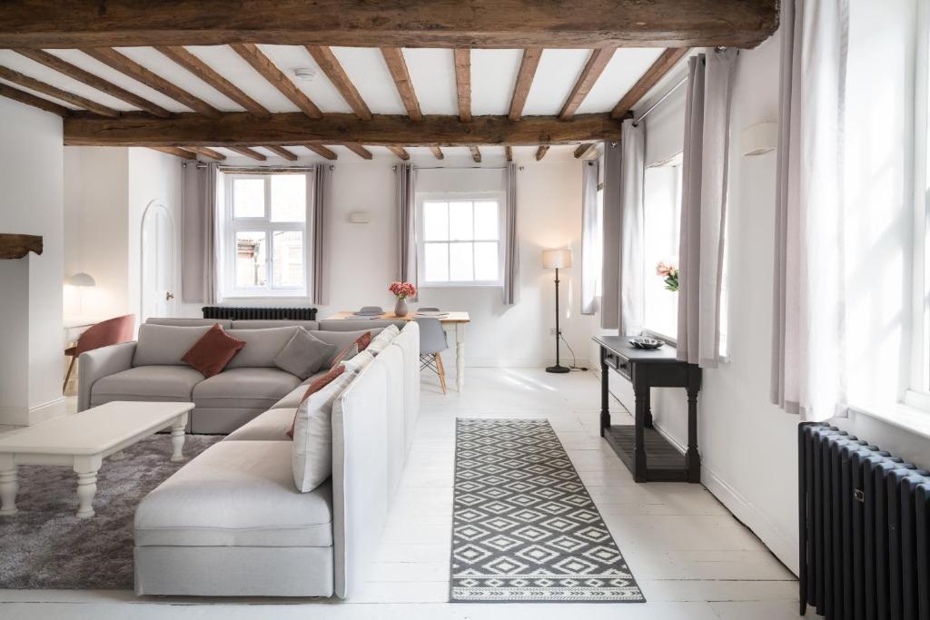 a living room with a couch and a table at York City Unique Apartment - Coffee Yard in York