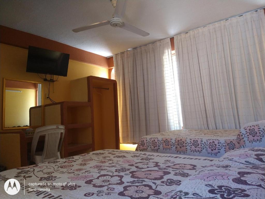 Letto o letti in una camera di Hotel Olimar