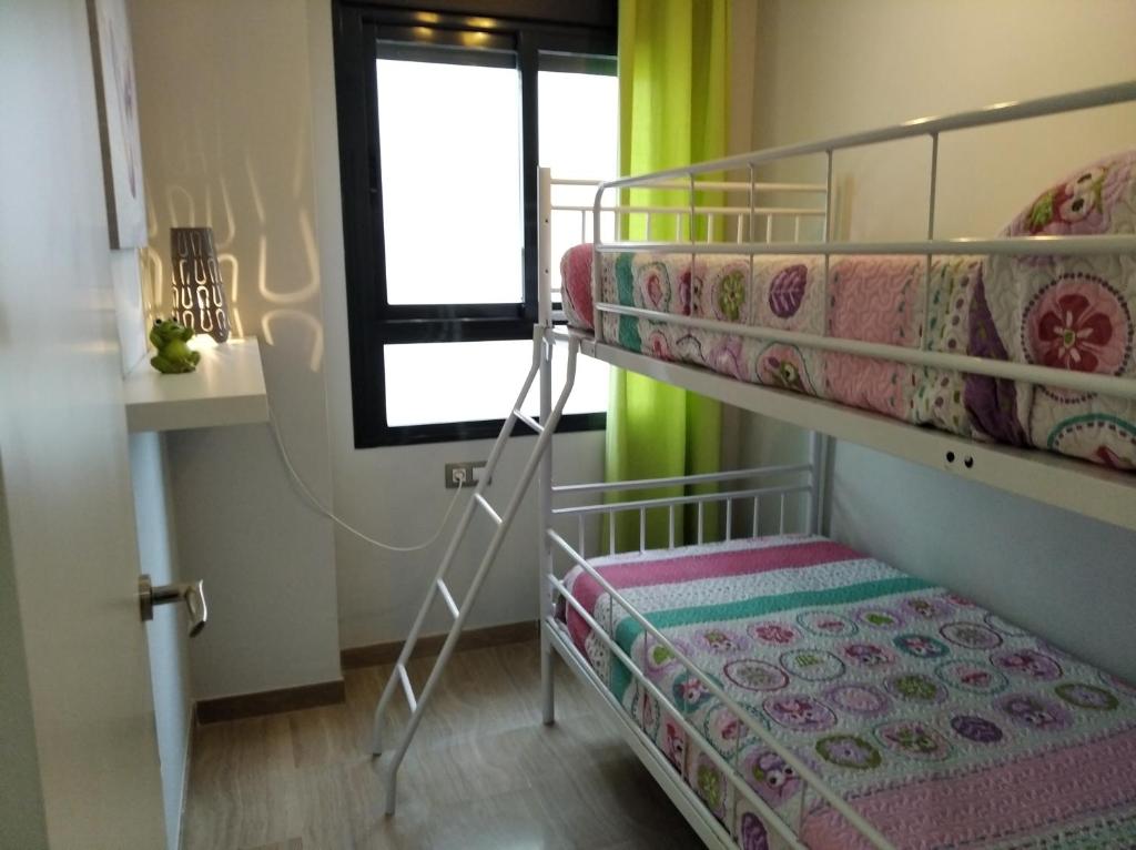 A bed or beds in a room at Camalavi
