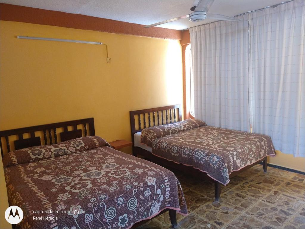 Letto o letti in una camera di Hotel Olimar