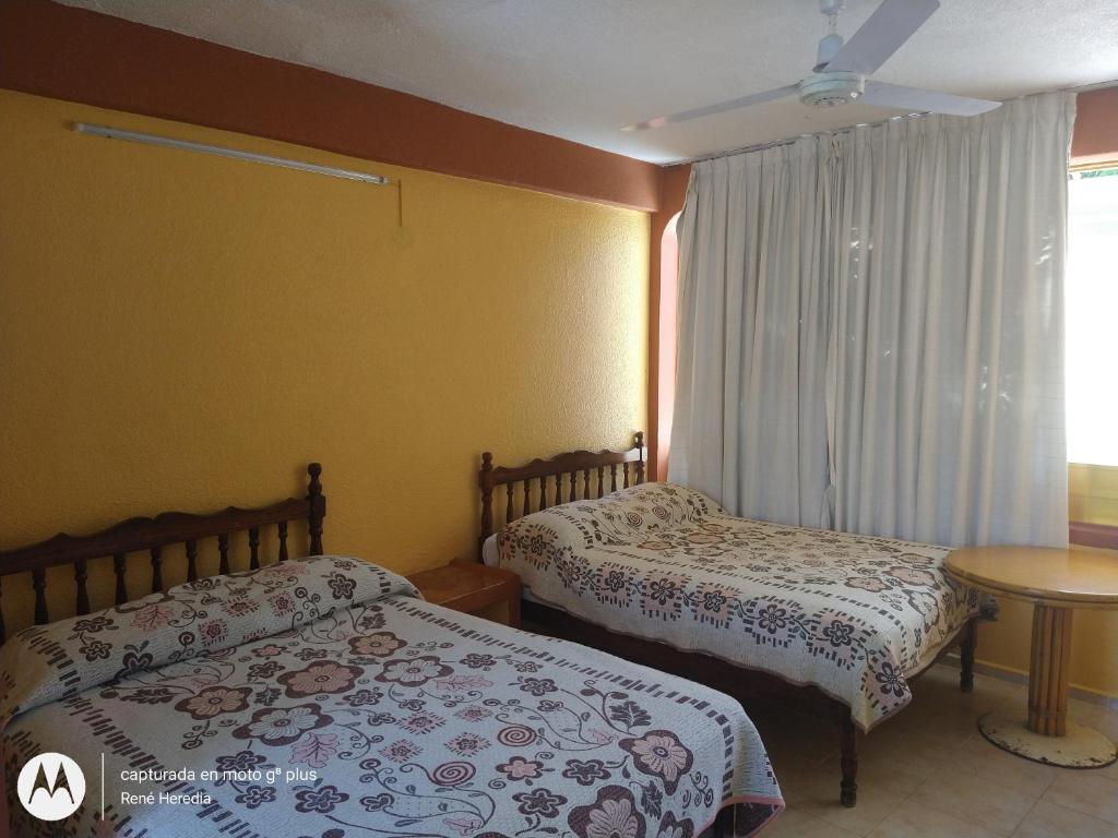 Letto o letti in una camera di Hotel Olimar