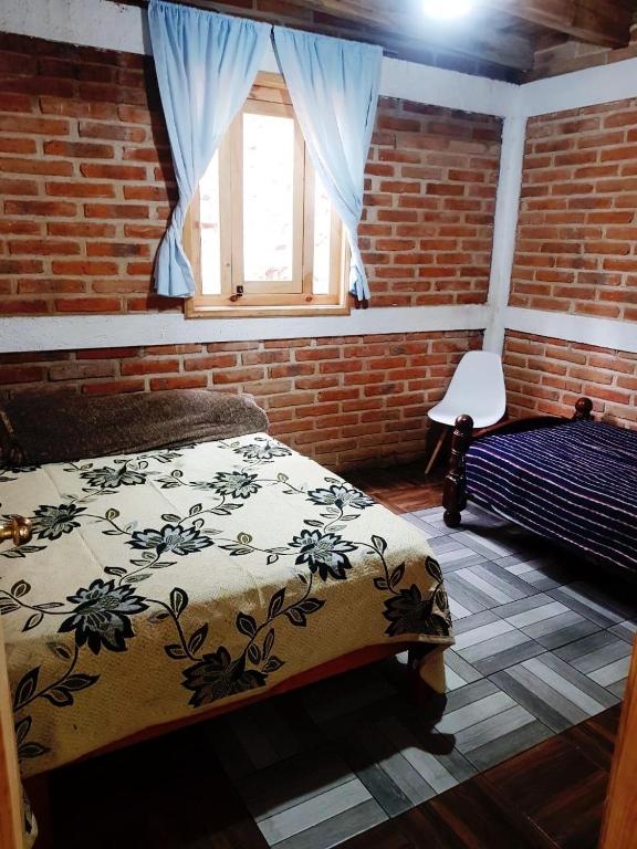 Postel nebo postele na pokoji v ubytování Cabañas las Alazanas