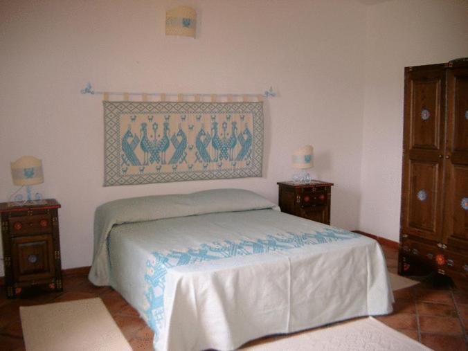 Postel nebo postele na pokoji v ubytování Agriturismo nuraghe Putzu Canu