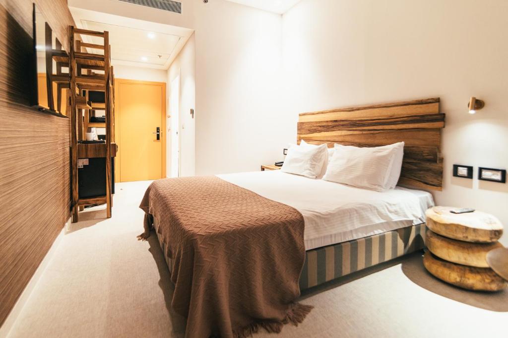 Postel nebo postele na pokoji v ubytování Even Derech by Smart Hotels