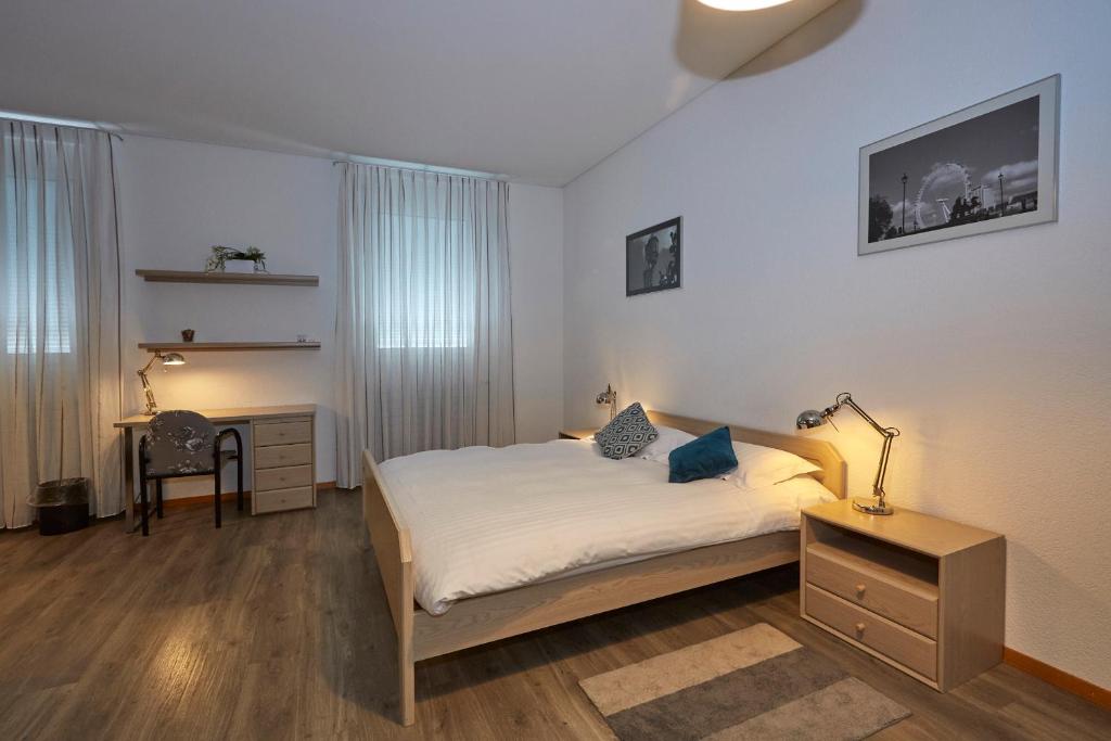 Postel nebo postele na pokoji v ubytování Les Chambres du CTN