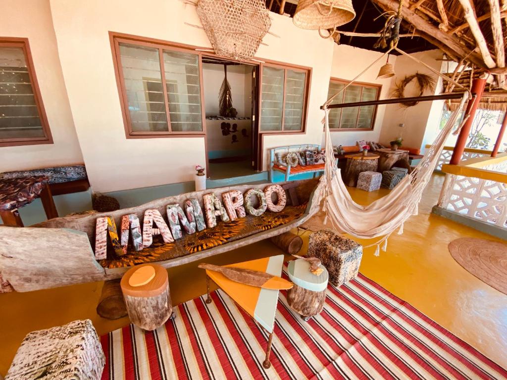 an aerial view of a living room with a hammock at Mama Root in Kizimkazi