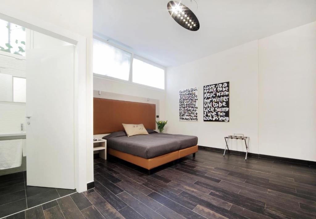 Posteľ alebo postele v izbe v ubytovaní Borgo Pio Suites Inn