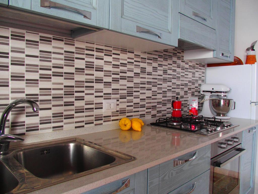 a kitchen with a sink and a counter top at GIARDINO SUL MARE in Amalfi