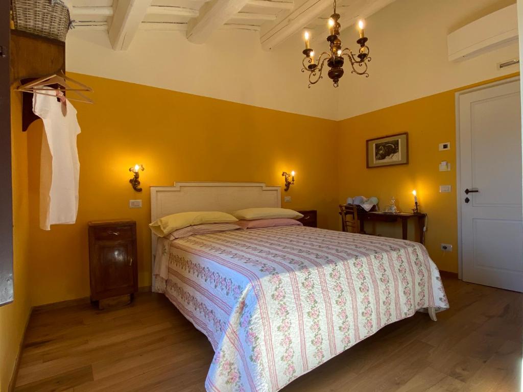 Postel nebo postele na pokoji v ubytování Podere Terreno alla via della volpaia