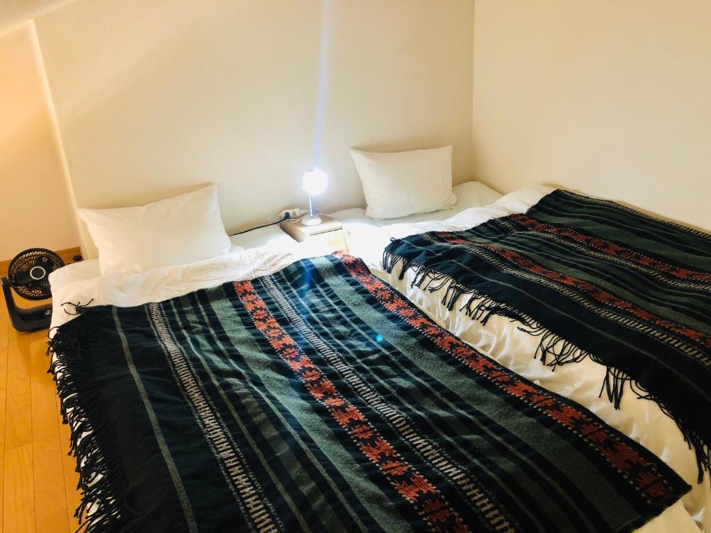 Katil atau katil-katil dalam bilik di Espoir Inn 1-201