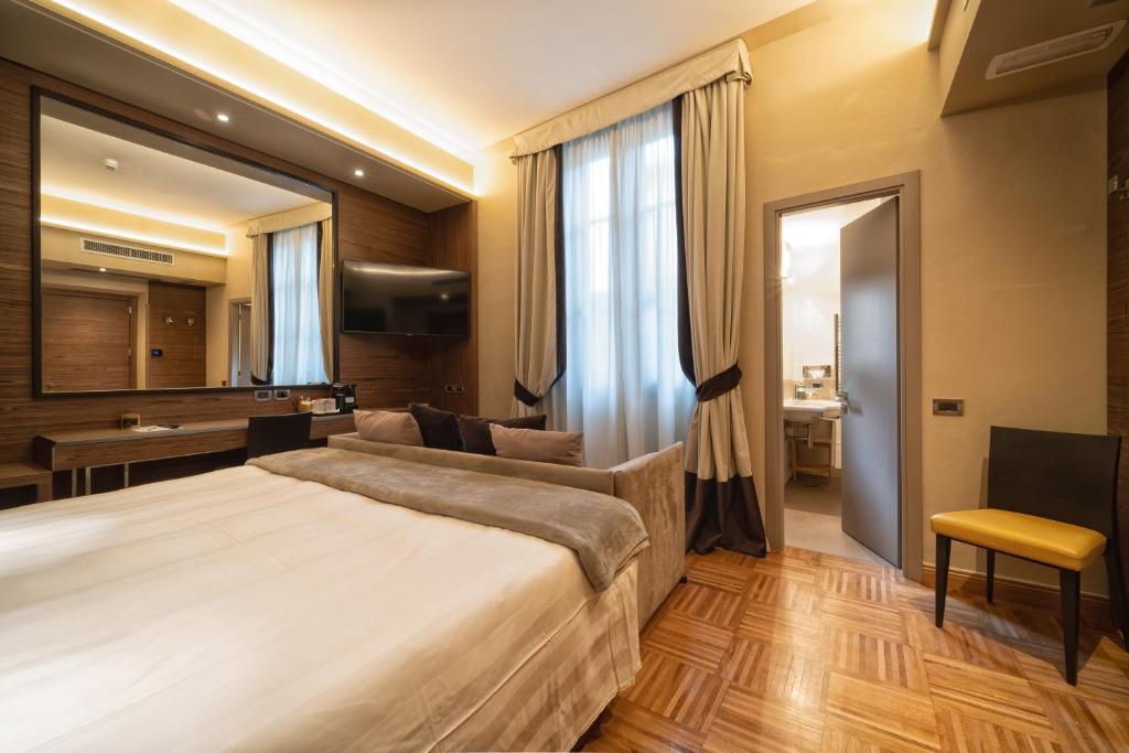 Łóżko lub łóżka w pokoju w obiekcie Solo Experience Hotel