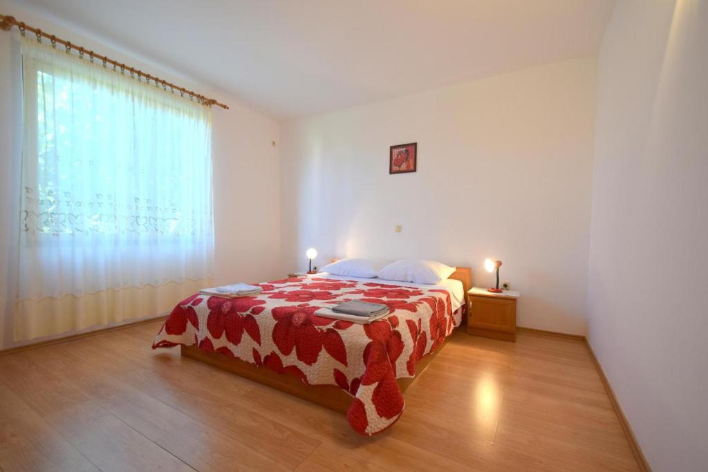 Postel nebo postele na pokoji v ubytování Apartment Anica