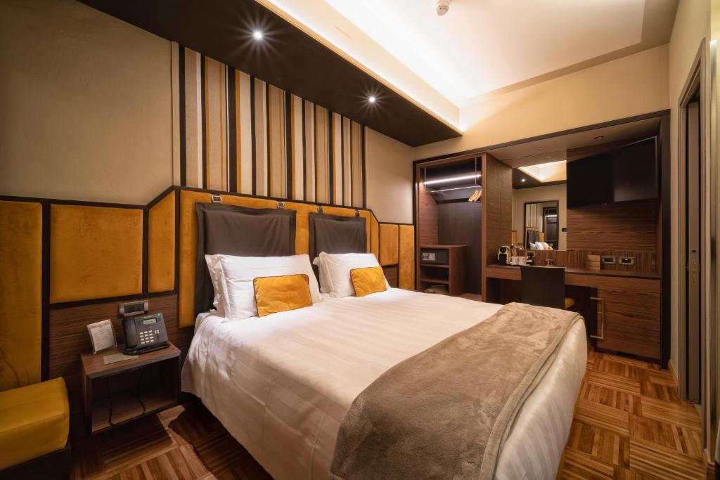 Łóżko lub łóżka w pokoju w obiekcie Solo Experience Hotel