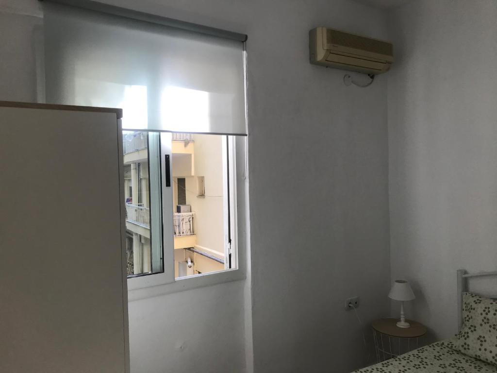Postel nebo postele na pokoji v ubytování Istos Apartment