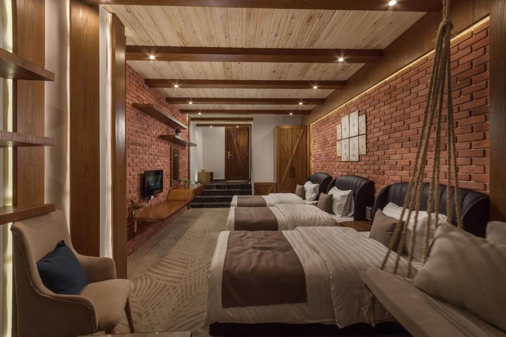Postel nebo postele na pokoji v ubytování Miramar Boutique Hotel