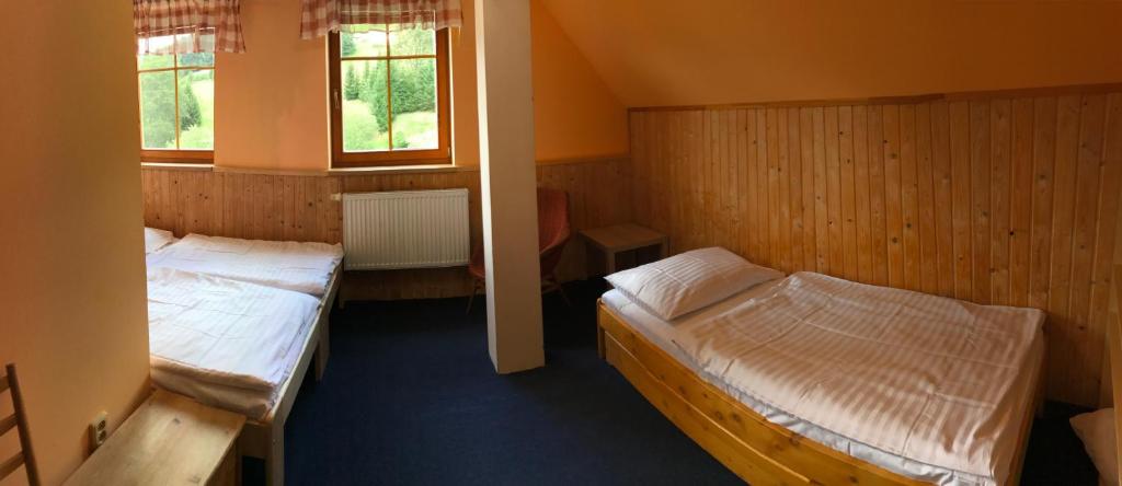 Postel nebo postele na pokoji v ubytování Penzion Bouda Tonička