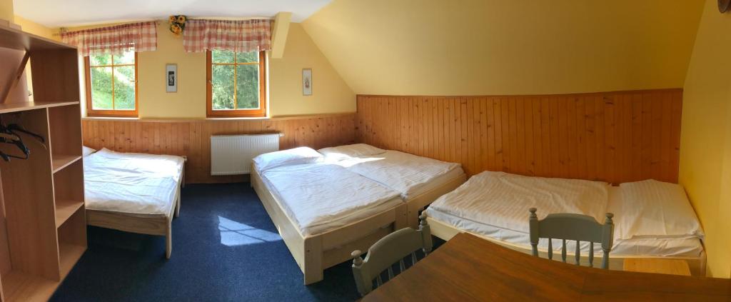 Postel nebo postele na pokoji v ubytování Penzion Bouda Tonička
