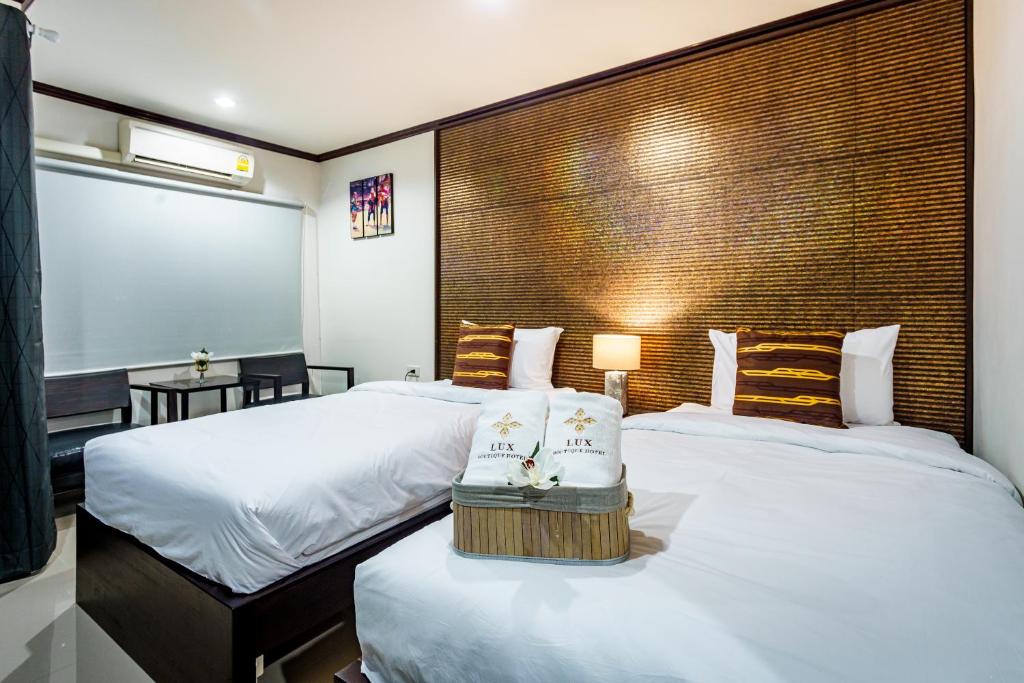 Postel nebo postele na pokoji v ubytování Lux Boutique Hotel
