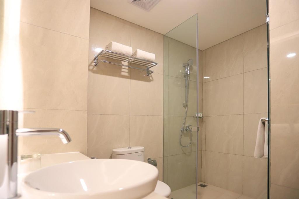 Koupelna v ubytování Luxury Inn Arion Hotel