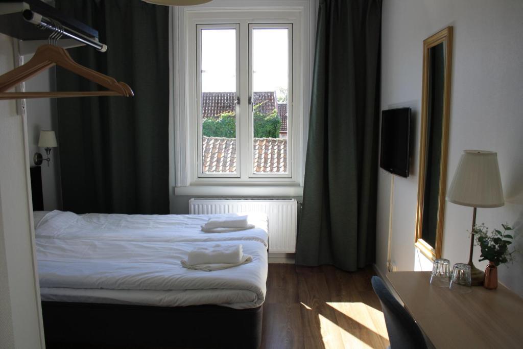 Postel nebo postele na pokoji v ubytování Grännagården Hotell och Restaurang