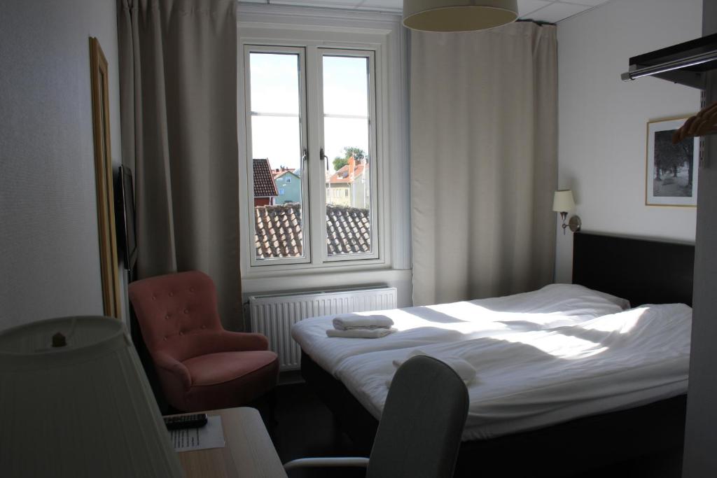 Postel nebo postele na pokoji v ubytování Grännagården Hotell och Restaurang
