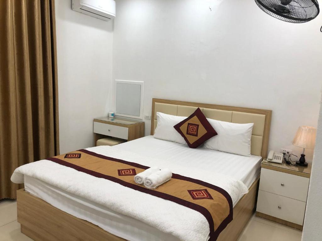 Postel nebo postele na pokoji v ubytování Nàng Hương Motel
