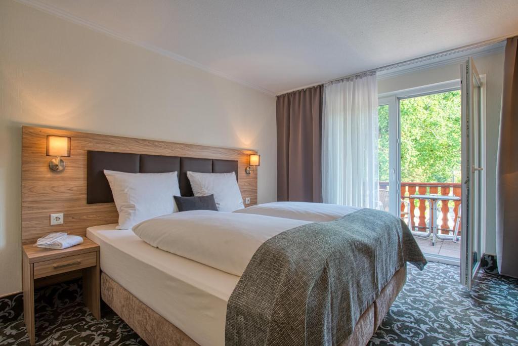 Кровать или кровати в номере Sporthotel Bad Bevensen