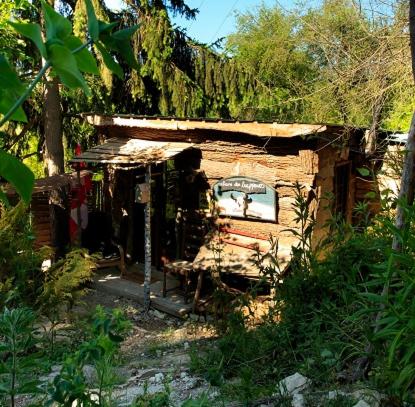 a small shack with a mirror on the side of it at La Cabane des Trappeurs in Crépy-en-Valois