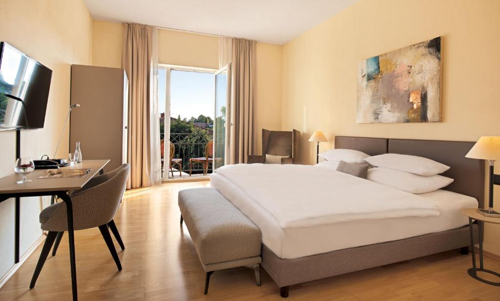 Postel nebo postele na pokoji v ubytování Hotel Villa Medici