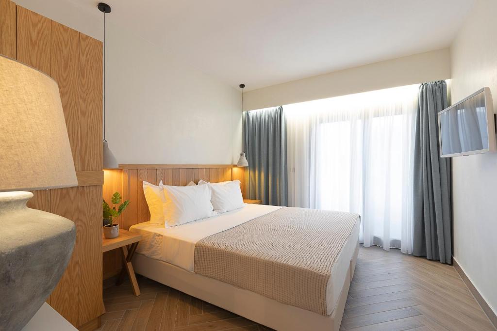 Postel nebo postele na pokoji v ubytování White Nest Villas