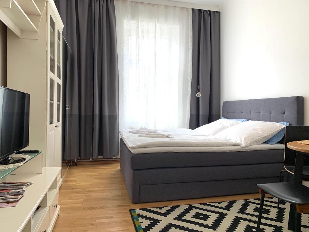 Cama ou camas em um quarto em Tada Apartment