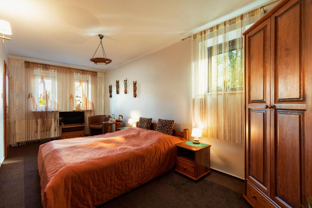Posteľ alebo postele v izbe v ubytovaní Villa Toscania-check in 24h