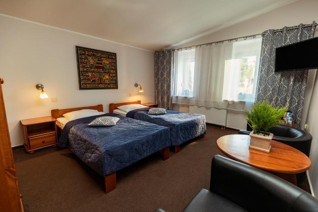 Posteľ alebo postele v izbe v ubytovaní Villa Toscania-check in 24h