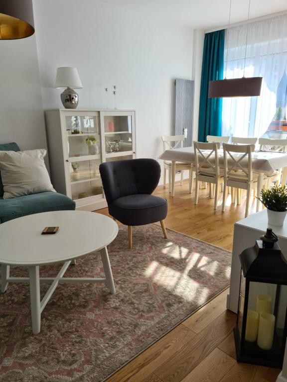 a living room with a couch and a table at Polana in Nowy Targ