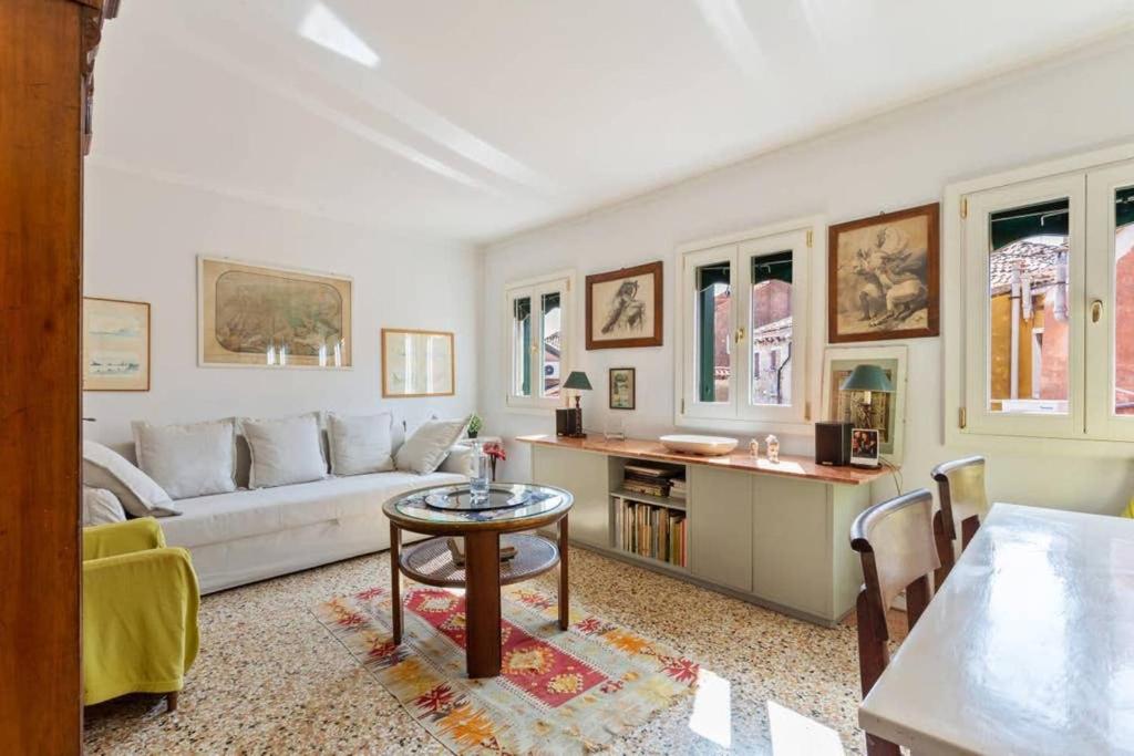 a living room with a white couch and a table at ֍ Splendido Attico - Arsenale - con Terrazza ֍ in Venice