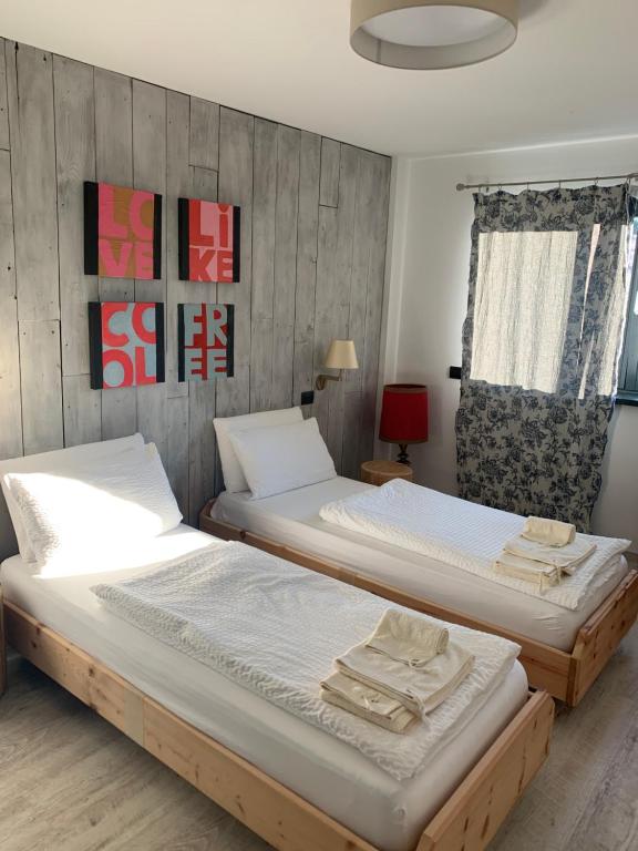 Postel nebo postele na pokoji v ubytování Affittacamere Casa Ester