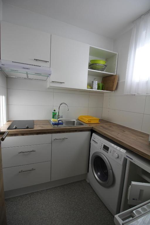 Kuchyň nebo kuchyňský kout v ubytování Atrium Garni