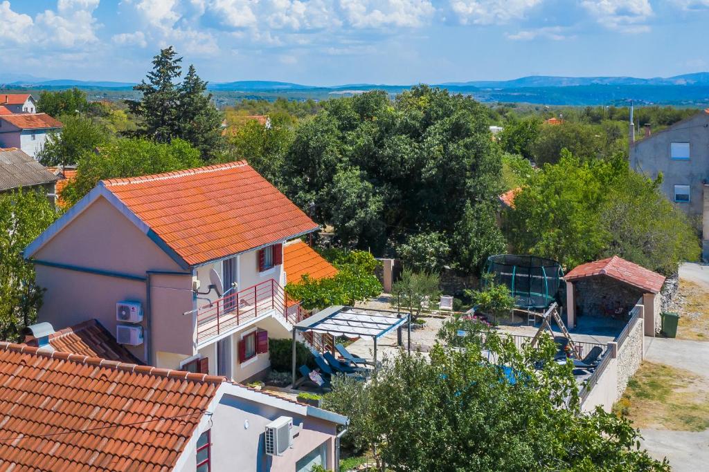 an overhead view of a house with an orange roof at Holiday Home Rosko in Skradin