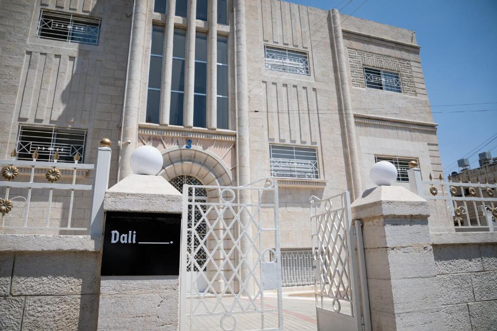 a building with a gate in front of it at Dali House in Amman