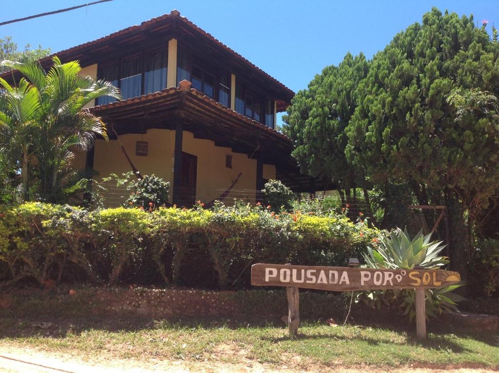 a sign in front of a house at Pousada Por do Sol in Sao Jorge