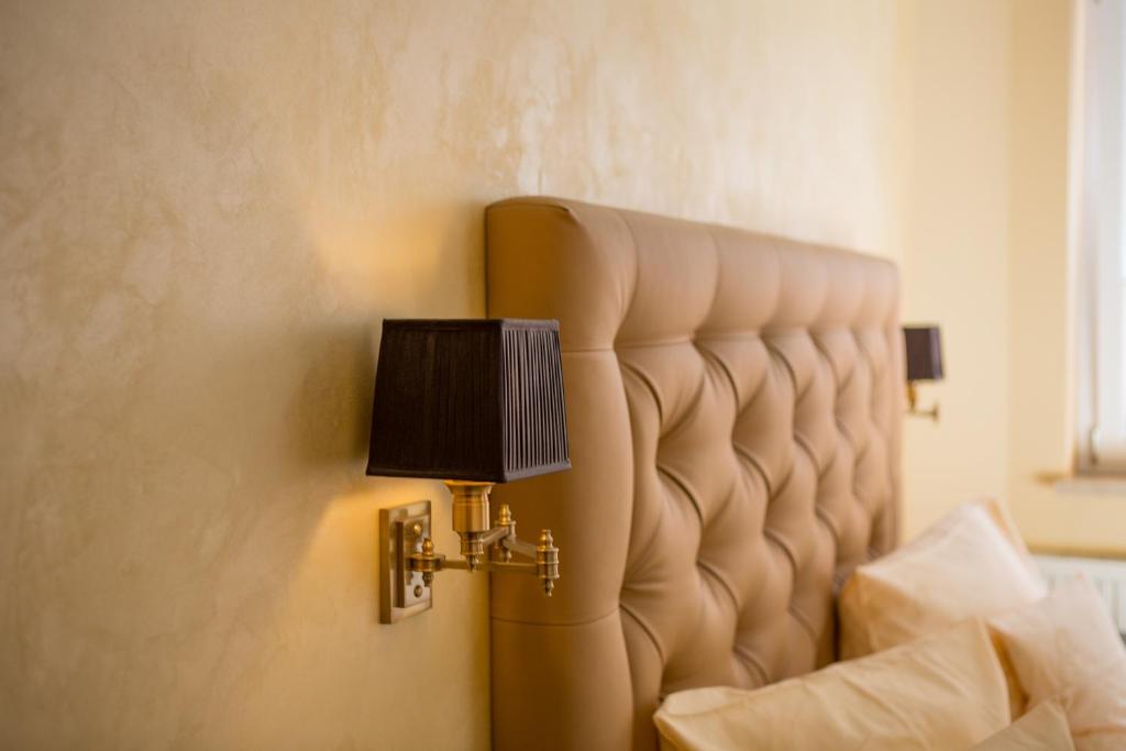 Postel nebo postele na pokoji v ubytování Hotel Heidelberger Hof