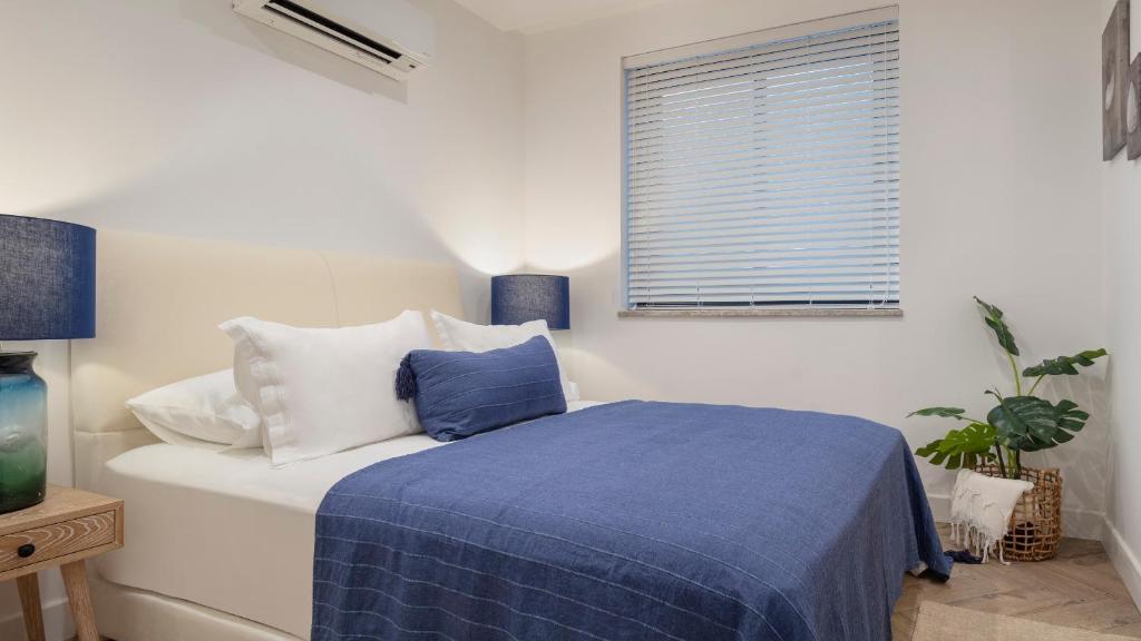 A bed or beds in a room at Ada Dreams City