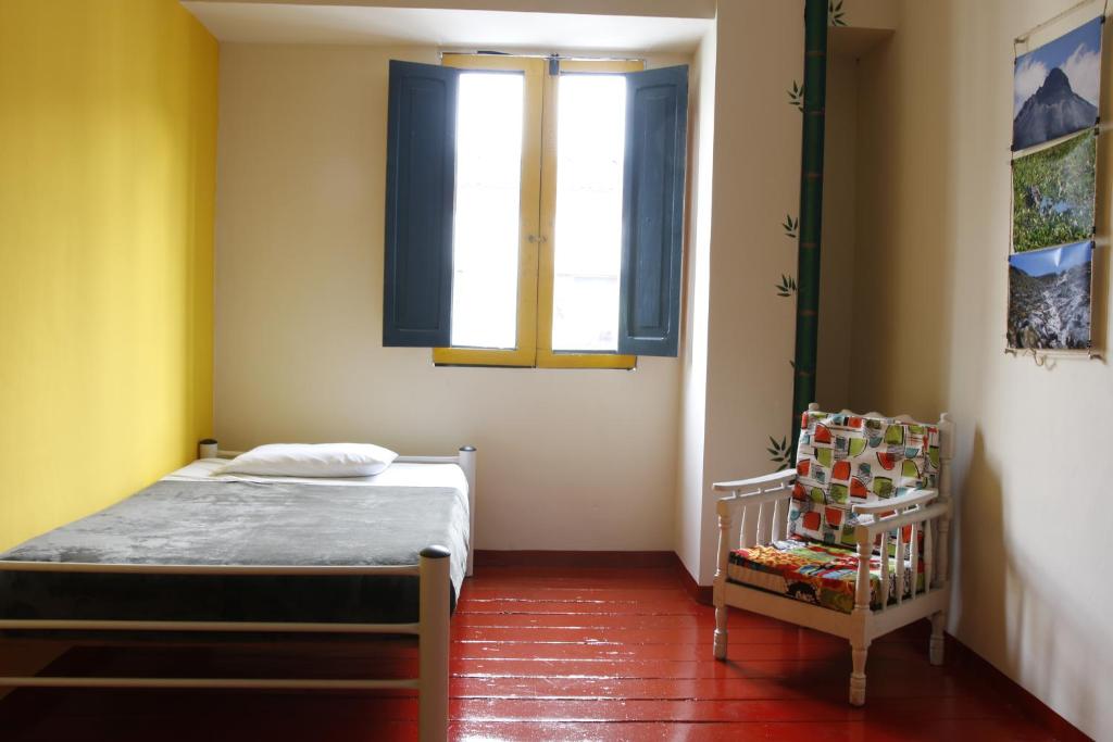 Postel nebo postele na pokoji v ubytování Golden Frog Manizales