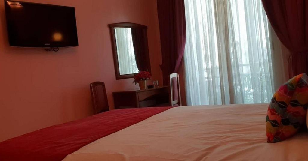 Postel nebo postele na pokoji v ubytování Hôtel Amouday