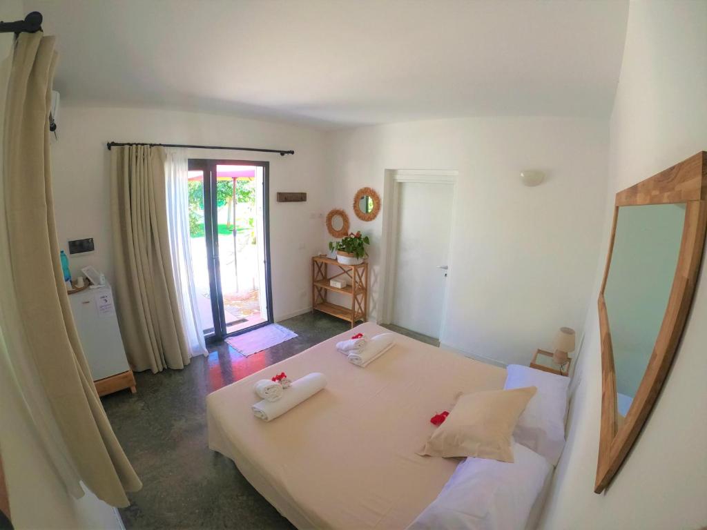 Postel nebo postele na pokoji v ubytování MAYANA SICILY - The suites
