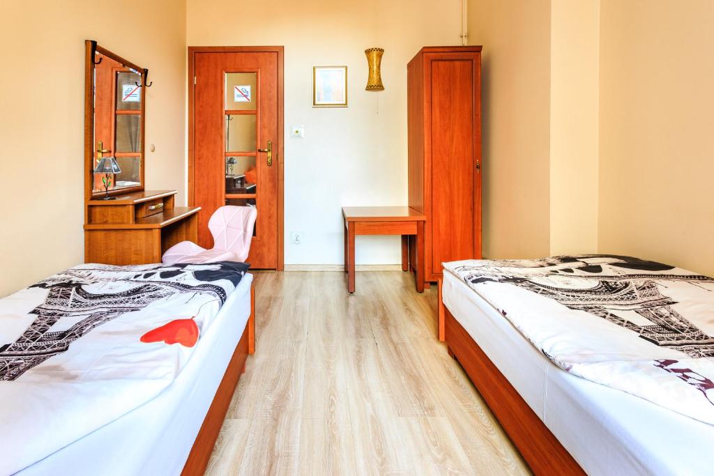 Uma cama ou camas num quarto em Babel Hostel, Dworzec PKP, Rynek